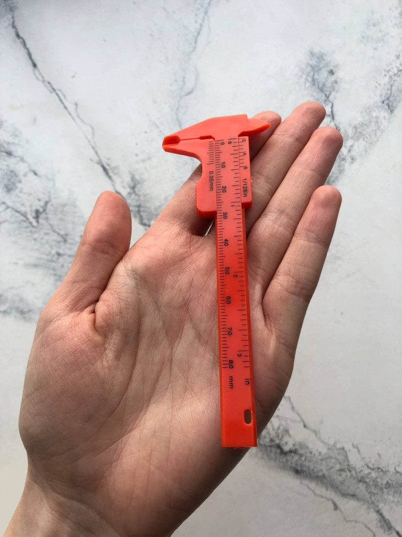 Eyebrow caliper, orange Eyebrow caliper, orange