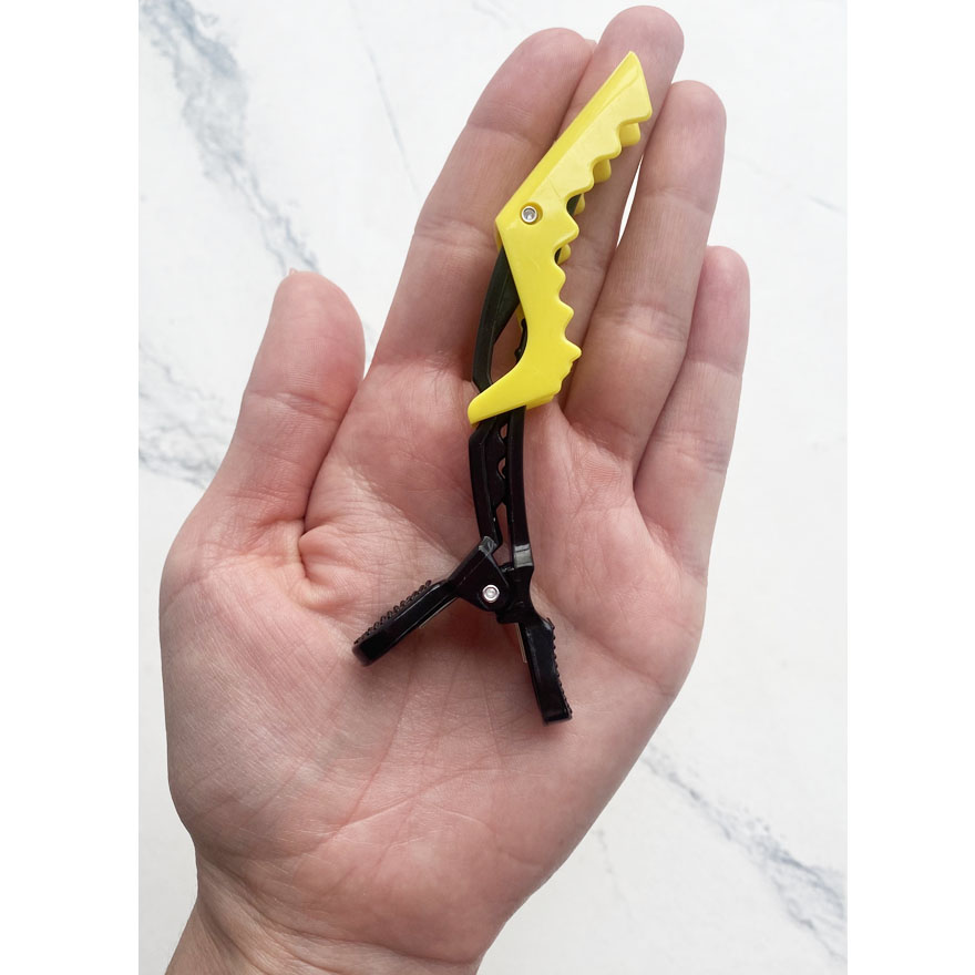 Zatyskach for hair (plastic crocodile), black zhovtim