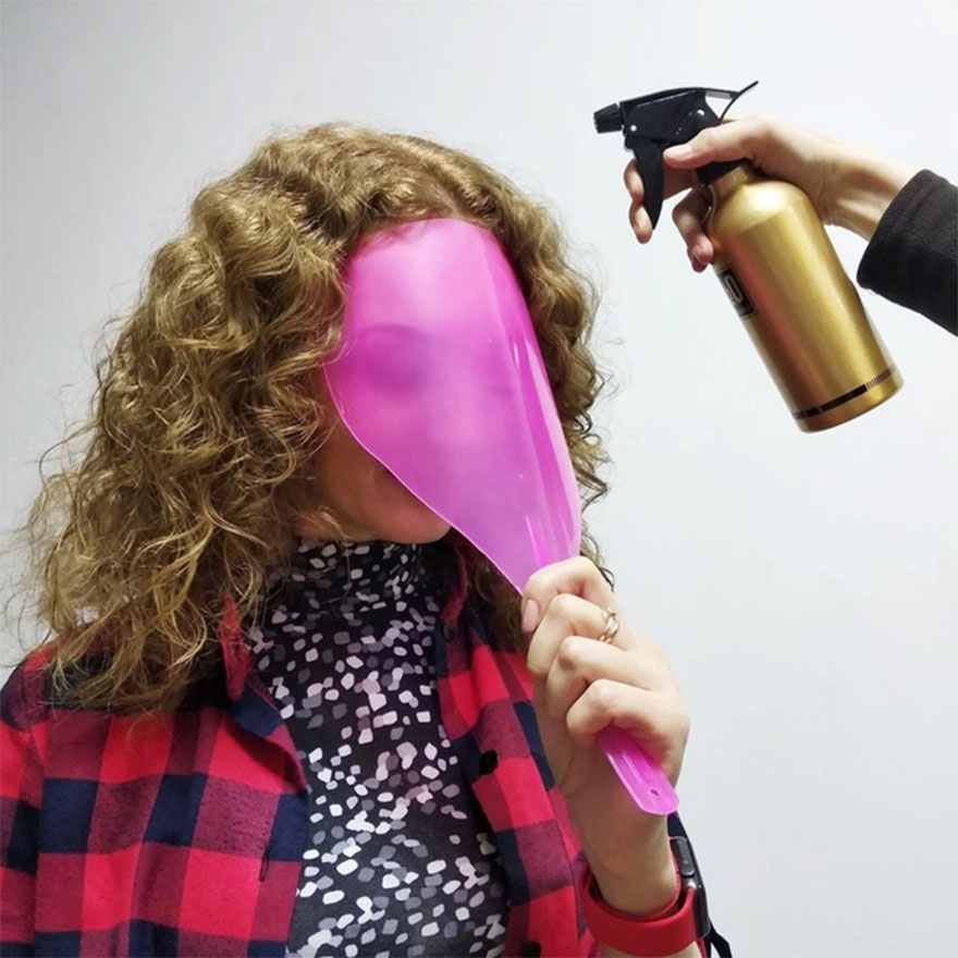Protective face shield with transparent handle Protective face shield with transparent handle