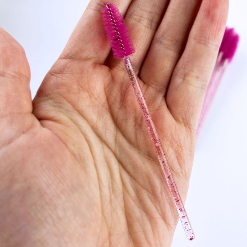 Eyelash brush, nylon, fuchsia on a transparent base with pink glitter (50 pcs/pack)