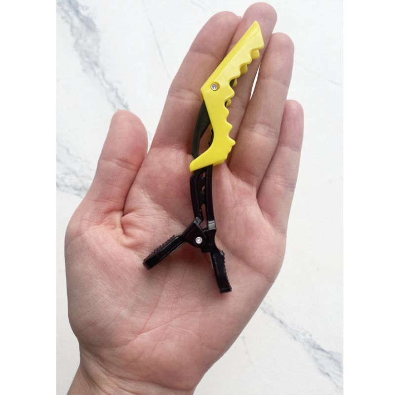 Zatyskach for hair (plastic crocodile), black zhovtim